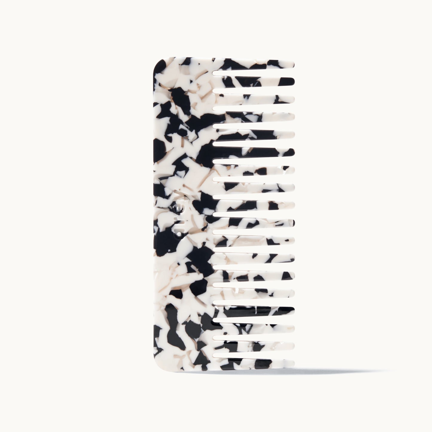 Black and white patterned comb on a white background