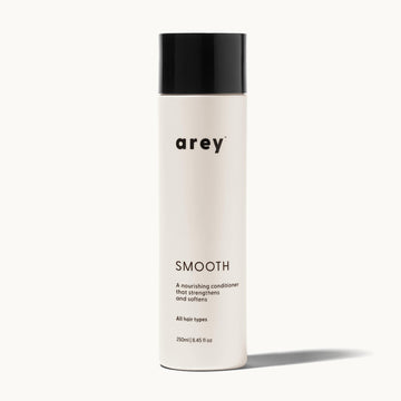 Bottle of arey Smooth conditioner on a white background