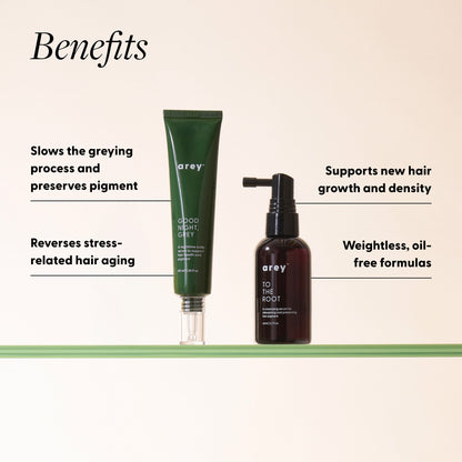 Two Arey serum products displayed on a cream shelf with green stripe detail. Text overlay reads: "Benefits". To the left of the green Good Night, Grey tube: "Slows the greying process and preserves pigment" and "Reverses stress-related hair aging." To the right of the black To The Root bottle: "Supports new hair growth and density" and "Weightless, oil-free formulas."