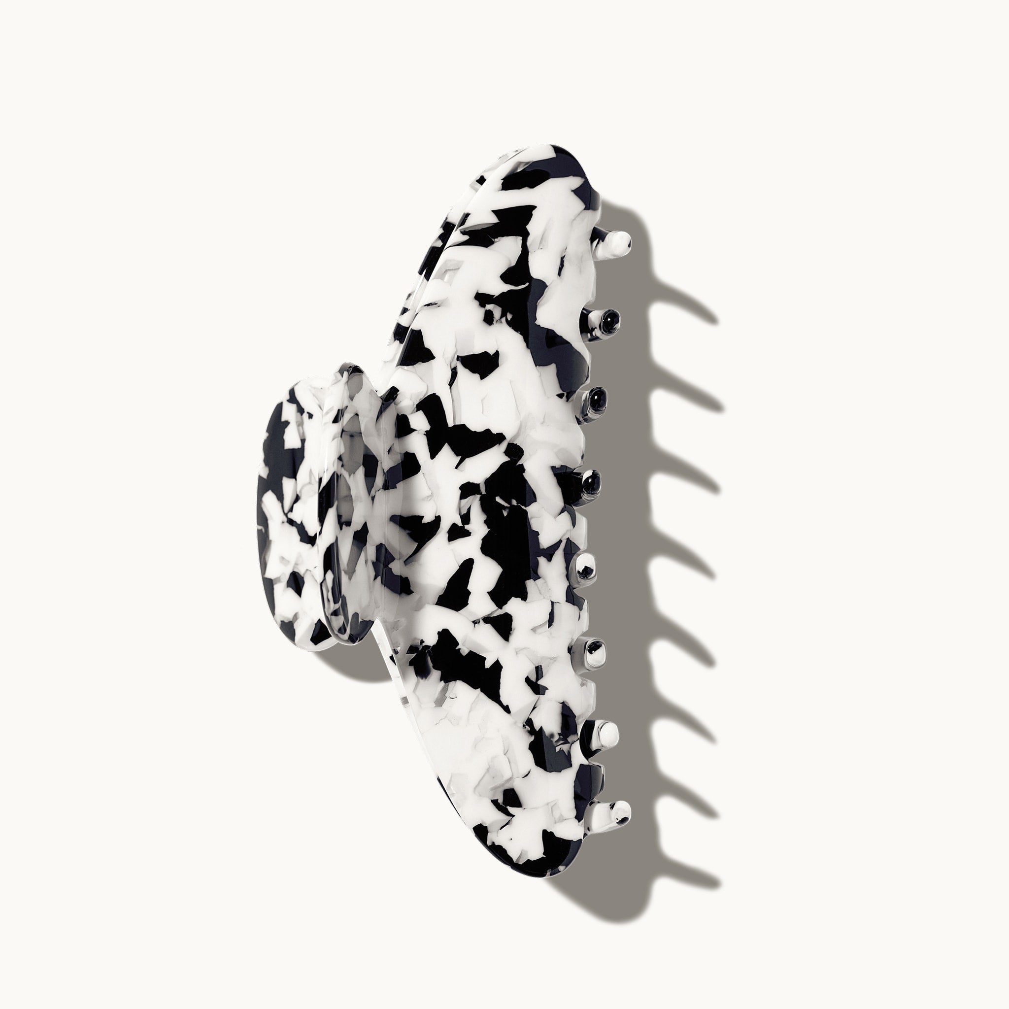 Black and white patterned hair clip on a white background