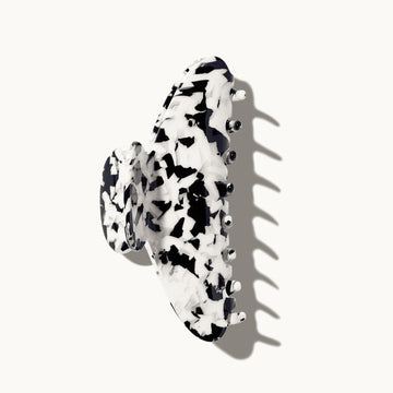 Black and white patterned hair clip on a white background