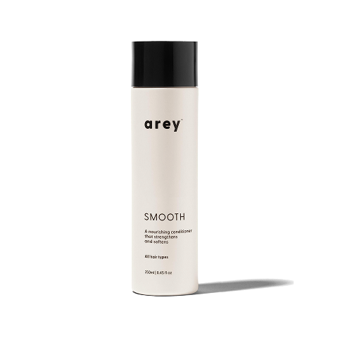 Bottle of 'arey' smooth conditioner on a white background