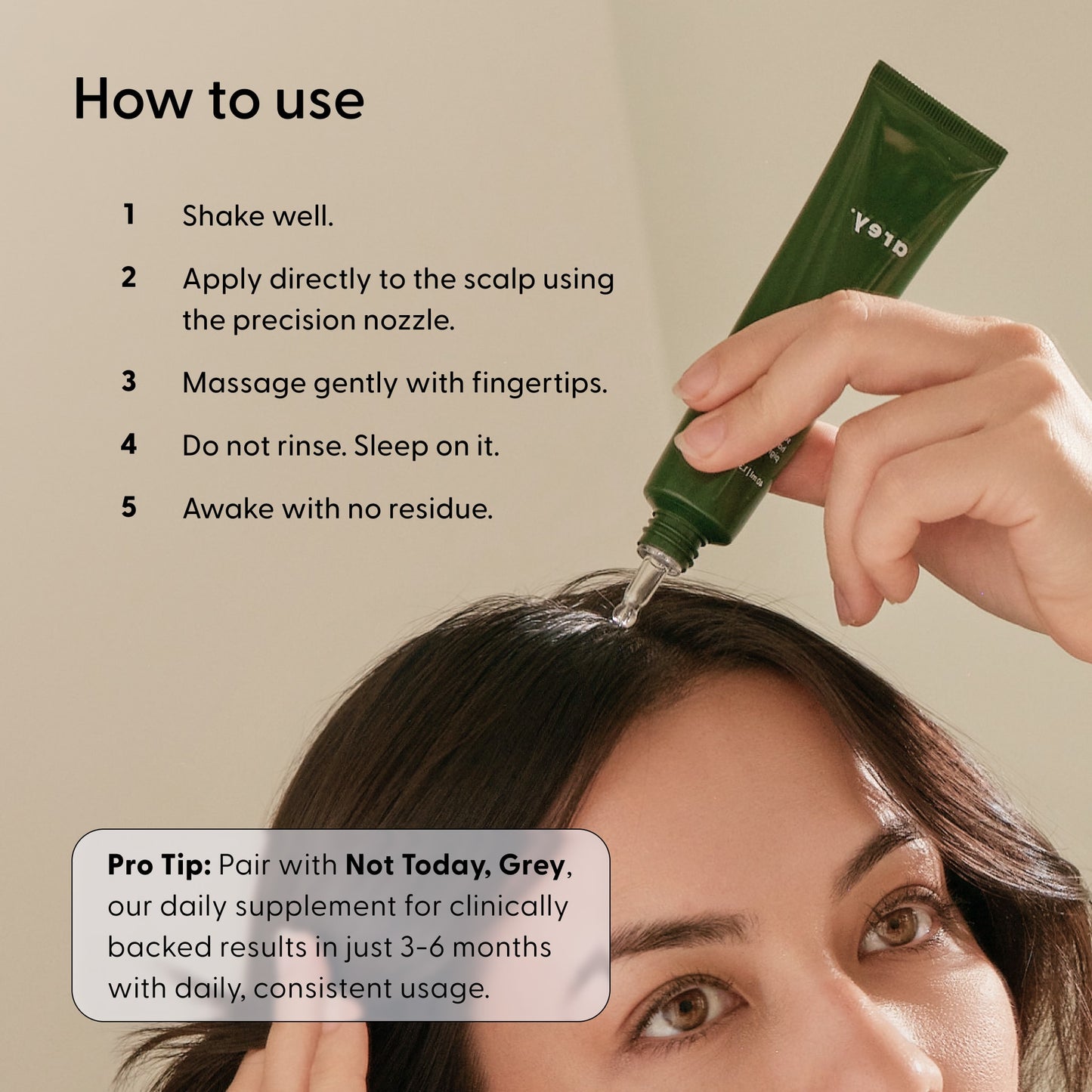 A person applies Arey’s Good Night, Grey® serum to their scalp using a precision nozzle. Step-by-step usage instructions appear beside them. A Pro Tip box suggests pairing it with a daily supplement or integrating it into an overnight scalp treatment for best results.