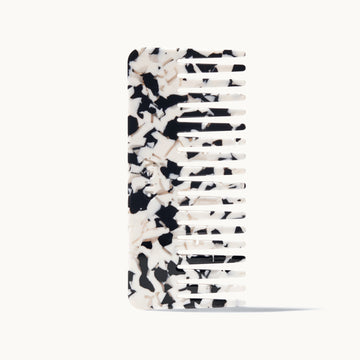 Black and white patterned comb on a white background