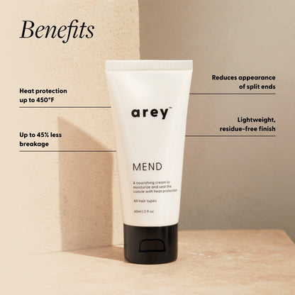 Tube of arey MEND hair care product with benefits listed on a beige background