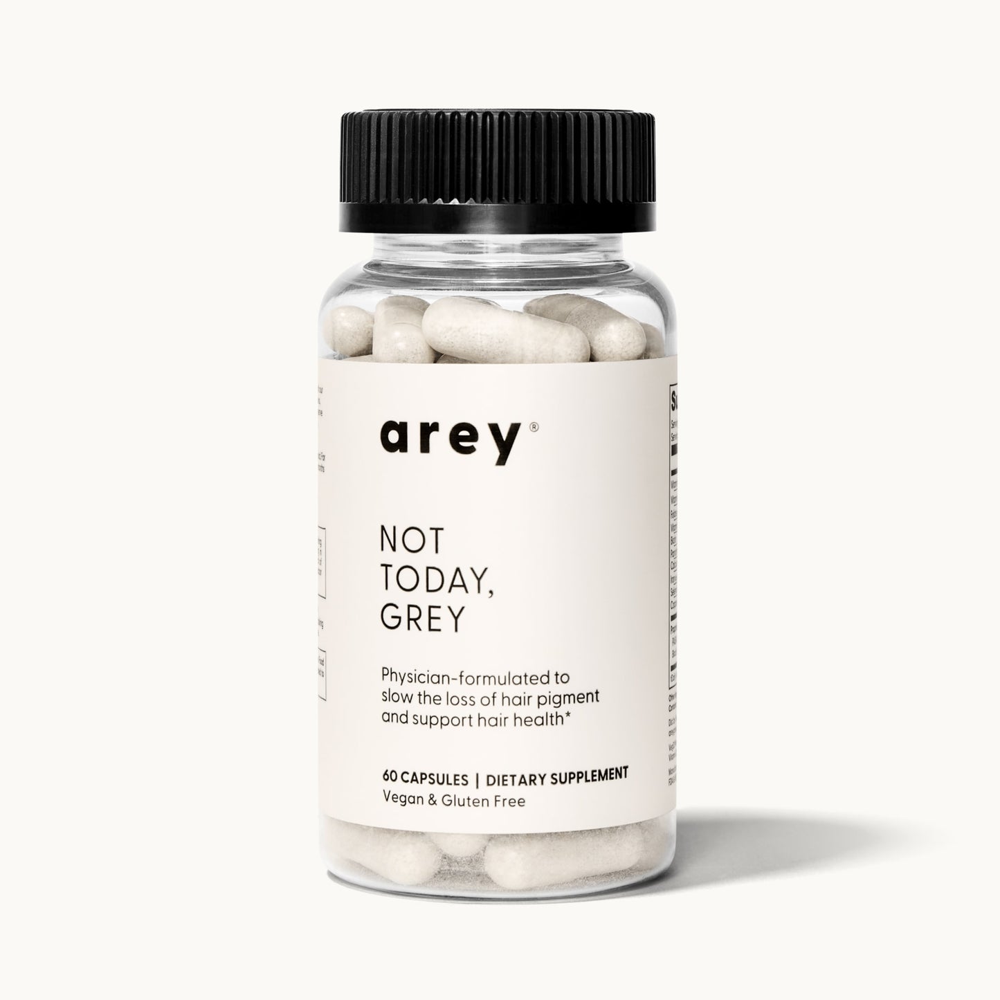 Product shot of a single Arey Not Today Grey supplement bottle on a white/cream background. Label reads: arey® Not Today, Grey. "Physician-formulated to slow the loss of hair pigment and support hair health.†" 60 Capsules, Dietary Supplement, Vegan & Gluten Free.
