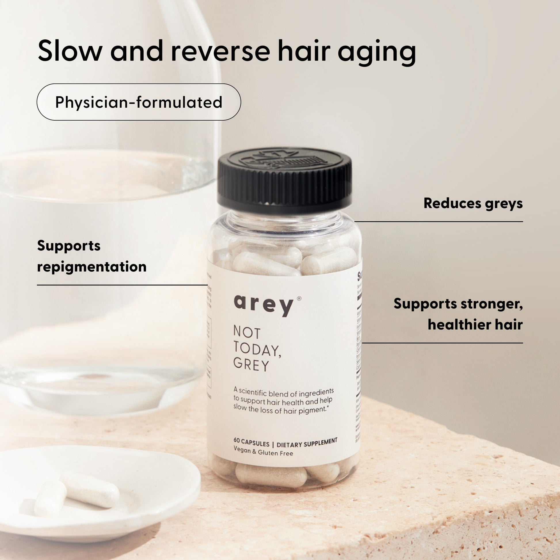 A bottle of Arey Not Today, Grey™ capsules—a premium hair supplement—is displayed on a table with several capsules beside it. Text highlights its benefits: slowing the aging of hair, reducing grey strands, supporting natural repigmentation, and promoting thicker, healthier hair.