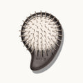 Arey Scalp Brush on cream background showing the bristle side. The dark wood brush has metal nickel-plated bristles on a natural rubber cushion base, with the arey brand name on the handle.