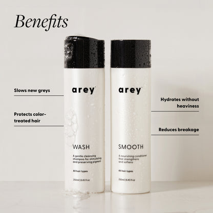 Arey Wash and Smooth bottles with benefits: slows new greys, protects color-treated hair, hydrates without heaviness, reduces breakage.