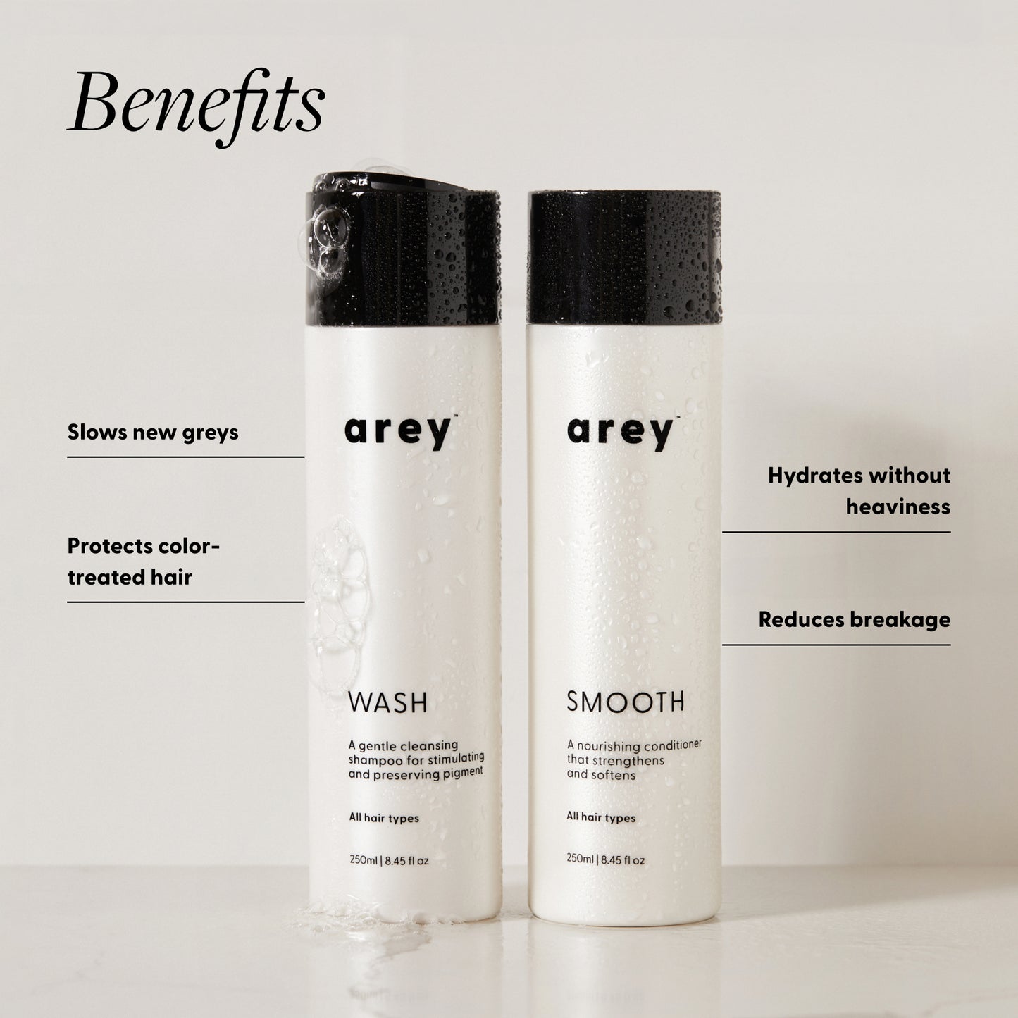 Arey Wash and Smooth bottles with benefits: slows new greys, protects color-treated hair, hydrates without heaviness, reduces breakage.