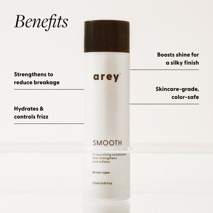 Arey Smooth Conditioner bottle (250ml / 8.45 fl oz) with benefits labeled. Text reads: Benefits — Strengthens to reduce breakage. Hydrates & controls frizz. Boosts shine for a silky finish. Skincare-grade, color-safe.
