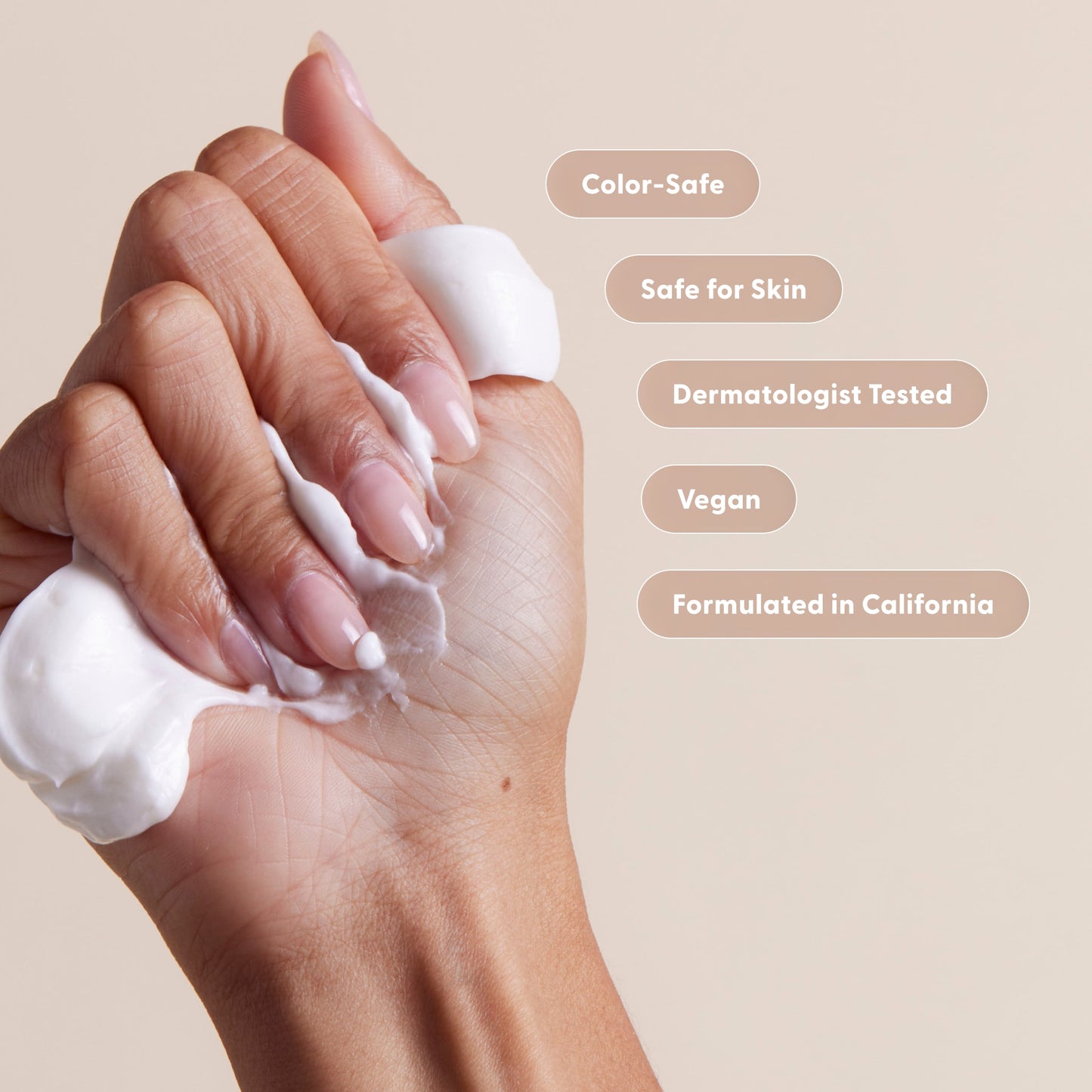 Hand applying conditioner with product features listed on a beige background