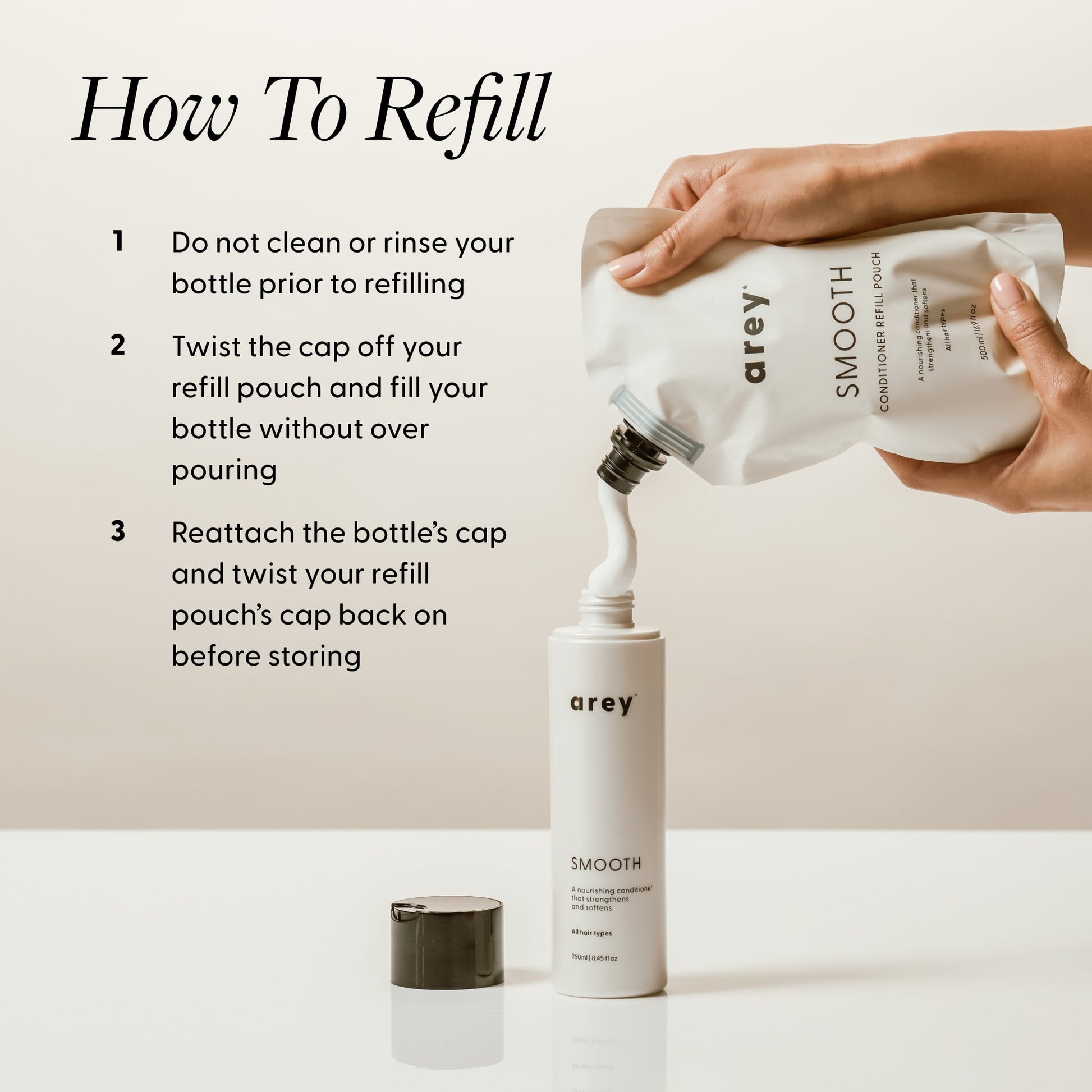 Step-by-step refill instructions with hands pouring Arey Smooth Conditioner Refill Pouch into a bottle. Text reads: How To Refill — 1. Do not clean or rinse your bottle prior to refilling. 2. Twist the cap off your refill pouch and fill your bottle without over pouring. 3. Reattach the bottle's cap and twist your refill pouch's cap back on before storing.