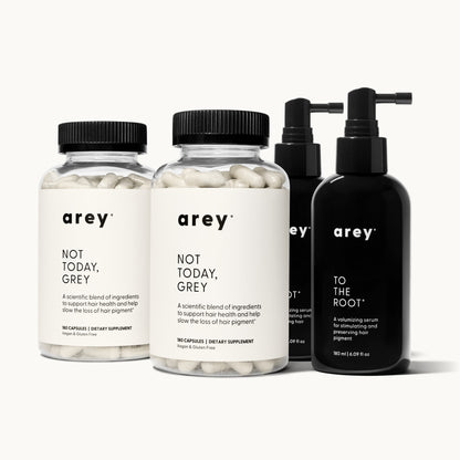 Arey 6-month system supply on a cream background. Three products shown: two Arey Not Today, Grey supplement bottles (180 capsules / Dietary Supplement each) and one Arey To The Root serum bottle (180 ml / 6.09 fl oz).