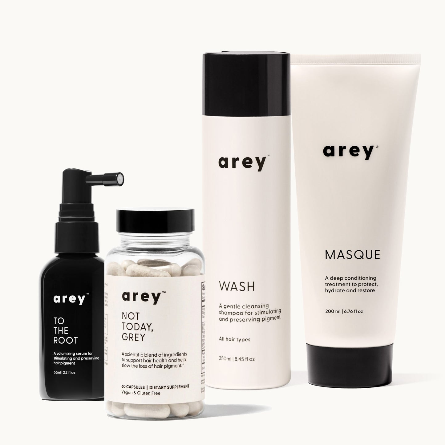 The Restorative Kit by Arey, featuring To The Root serum, Not Today, Grey supplement, Wash shampoo, and Masque conditioner—products designed to slow greying, support new growth, and deeply hydrate hair.