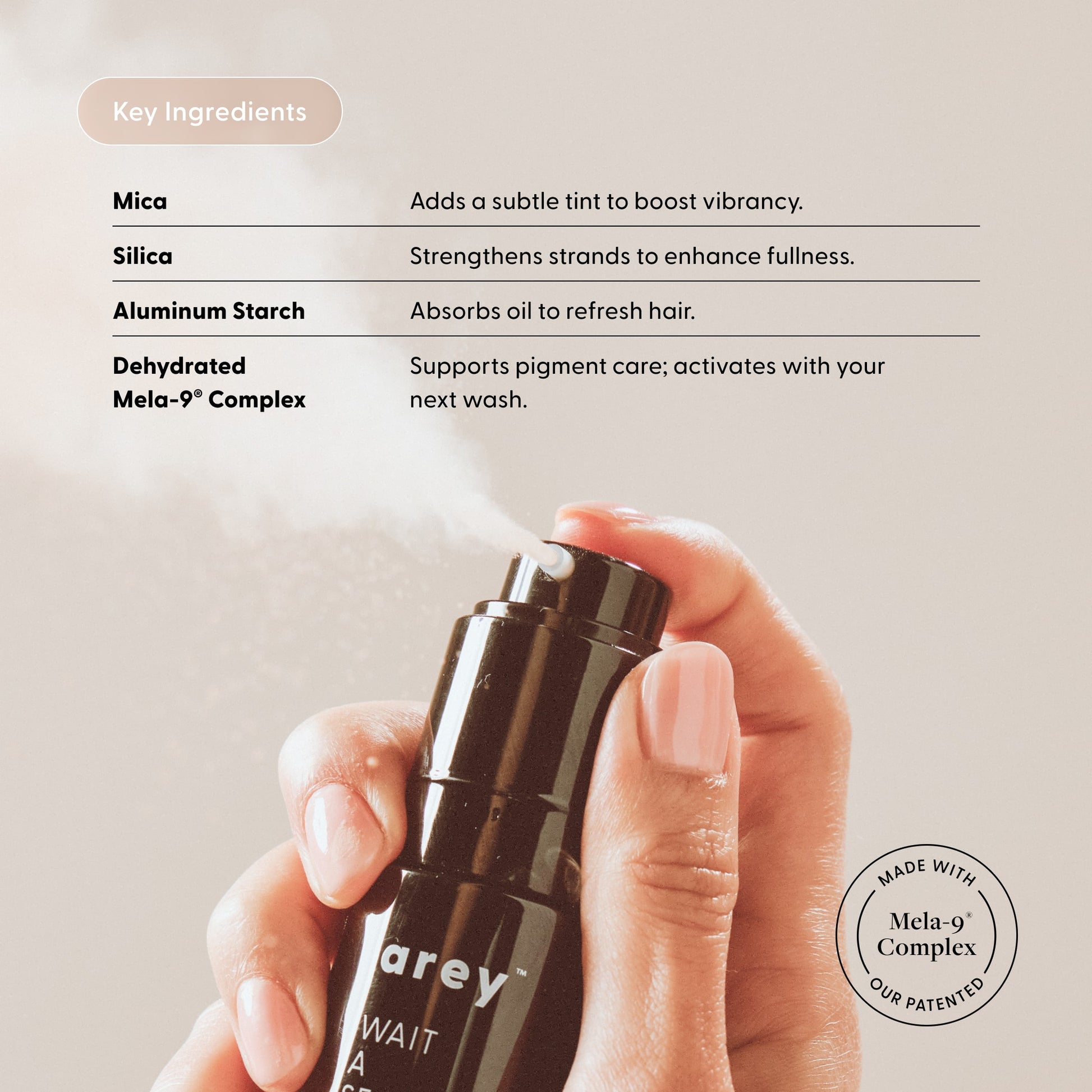 Hand holding a black bottle labeled 'arev' with key ingredients listed on a light background